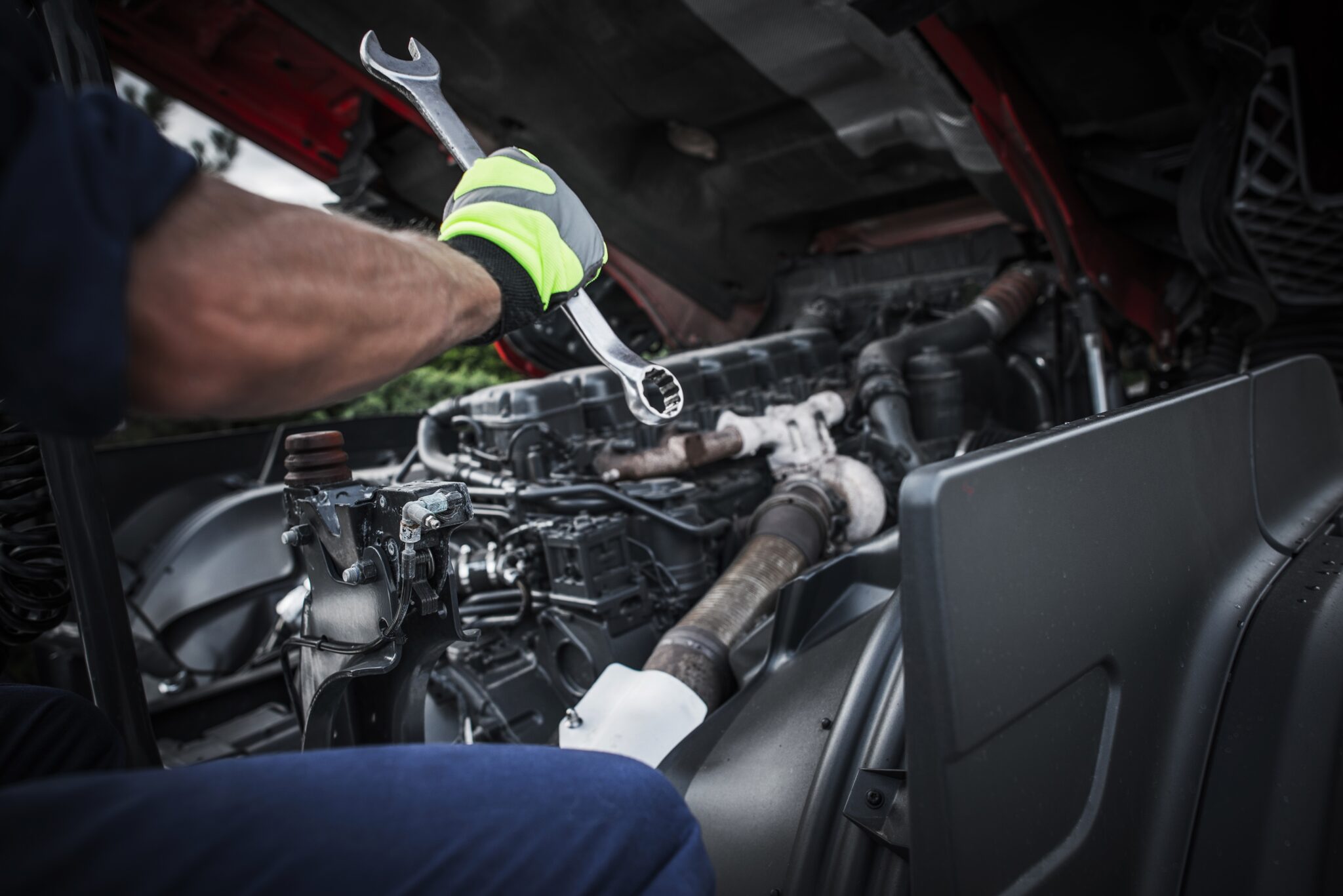 Diesel mechanic near me completing mobile truck repair near me on a heavy-duty semi engine